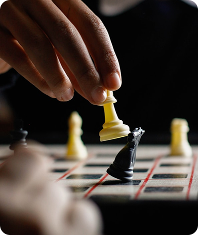 Hand moving a chess piece